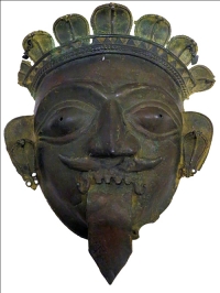 Title : Bhuta Mask From Karnataka<br> Medium: Mixed Alloy<br> Size : 11.5 x 9 x 5 inches